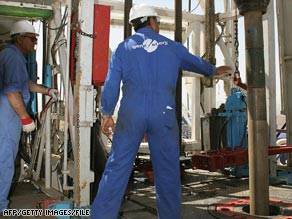 Workers operate an oil drilling facility in northern Iraq.