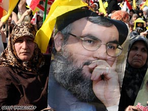 Supporters carry posters of Hezbollah chief Hassan Nasrallah during demonstrations in May.