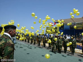 Hezbollah fighters prepare to receive bodies returned from Israel in Naqoura, Lebanon, on Wednesday.