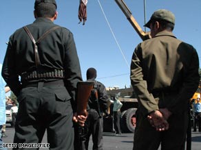 A convicted Iranian drug dealer is hanged from a crane in the southern city of Shiraz in September.
