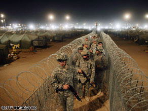 U.S. guards patrol at Camp Bucca in Iraq in May.