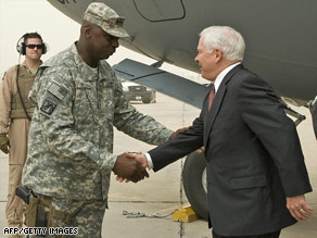 Robert Gates is greeted Monday at Baghdad International Airport by Army Lt. Gen. Lloyd Austin.