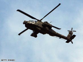 A U.S. army Apache helicopter flies over southern Baghdad, Iraq.