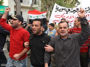 Iraqi refugees took to the streets in Damascus, Syria, on Wednesday to protest Sunday's airstrike.