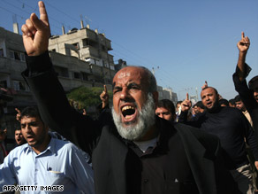 Palestinians shout during Wednesday's funeral of five militants killed Tuesday in an Israeli army operation.