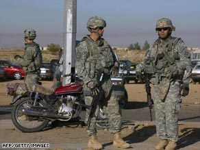 U.S. soldiers arrive on the scene of a suicide bombing Saturday in Kirkuk, Iraq.