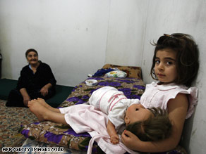 In late November, members of a Christian Iraqi family sit in a home in Lebanon after fleeing violence in Mosul.