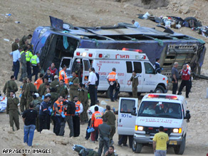 Rescuers gather at the site of the bus crash north of the Israeli Red Sea resort of Eilat.