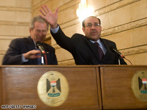 President Bush, left, ducks a shoe as Iraqi Prime Minister Nuri al-Maliki tries to protect him Sunday.