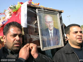 Iraqis carry the coffin of reporter Shihab al-Timimi, who died of gunshot injuries in February.