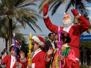 Iraqi children dress like Santa's elves for the Christmas party.