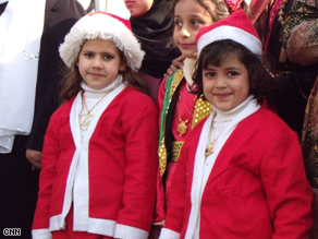 Iraqi children dress like Santa's elves for the Christmas party.