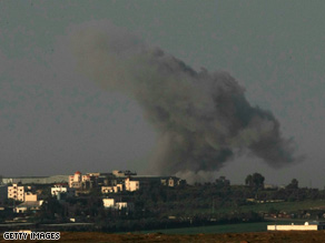 Smoke rises after an Israeli air force attack against Hamas militants in Gaza on Sunday as seen from Israel's border.