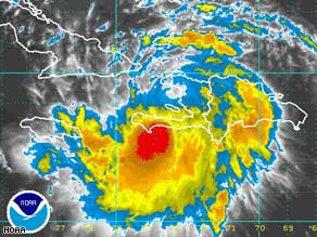 An infrared image shows Tropical Storm Fay just off Haiti on Saturday, heading west toward Cuba.