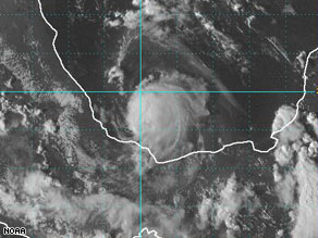 Tropical Storm Marco is just off the coast of Mexico, with sustained winds of 65 mph.
