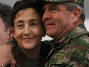 The commander of Colombia's Army, Gen. Mario Montoya, embraces former hostage Ingrid Betancourt