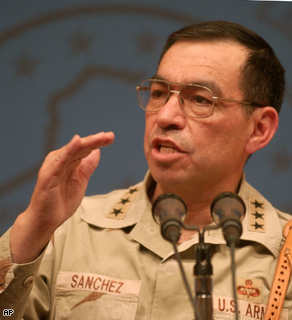 Ricardo Sanchez gestures during a press conference in Baghdad, November 2003.