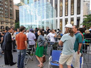 People waiting in line at the Apple Store in Manhattan for their chance to buy the 2nd generation iPhones.