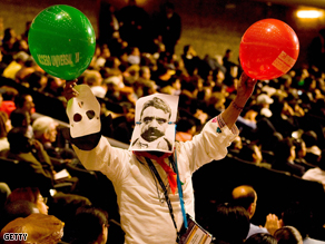 A protester stands at the opening ceremony of the XVII International AIDS conference in Mexico City