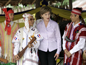 First Lady Laura Bush visits Karen refugees in national costumes during her visit to Mae La refugee camp in Thailand's Mae Sot town, Thursday.