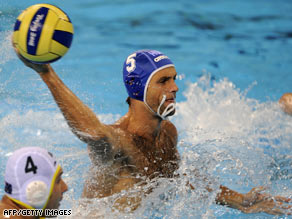 Music and mayhem: Tamas Kasasr of Hungary attempts to score against Australia.