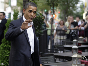 Sen. Barack Obama, D-Ill. waves as he arrives at a restaurant for dinner tonight.