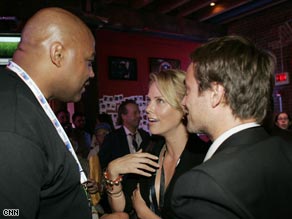 Basketball legend Charles Barkley, Oscar-winning actress Charlize Theron and movie star Stuart Townsend pictured at the CNN Grill.