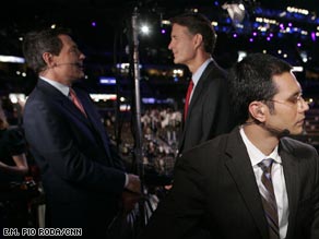 Jonathan Mann and Sen. Evan Byah (left and center) find a bit of space in the CNN box.