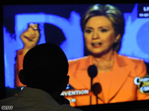 Sen. Barack Obama watches Sen. Hillary Clinton addressing the Democratic National Convention at a Democratic supporters' group in Billings, Montana, Tuesday.