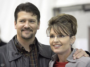 Alaska Gov. Sarah Palin standing beside her husband, Todd Palin, in Anchorage, Alaska in October, 2006. 