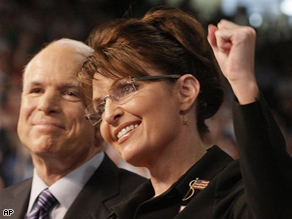 Presumptive Republican presidential nominee Sen. John McCain, left, smiles as his Vice Presidential running mate, Alaska Gov. Sarah Palin is introduced to supporters at a campaign rally in Dayton, Ohio, Friday.