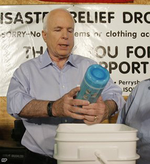 Sen. John McCain helps pack Hurricane Gustav relief packages at the ISOH/Impact charitable organization's facility in Toledo, Ohio, Monday.