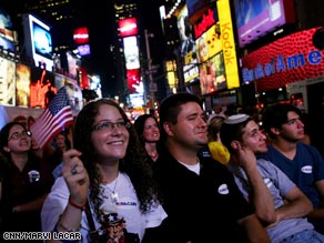 Crowds listen to McCains message in Times Square.