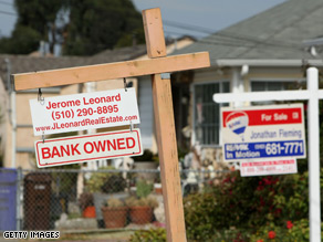 A sign posted in front of a bank owned home that is for sale in Richmond, California.