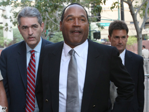 O.J. Simpson and his lawyers arrive at court today.