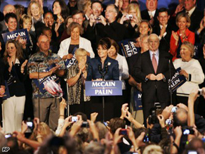Republican vice presidential candidate Alaska Gov. Sarah Palin, center, introduces Republican presidential candidate Sen. John McCain, Monday, during a rally in Kansas City, Missouri.