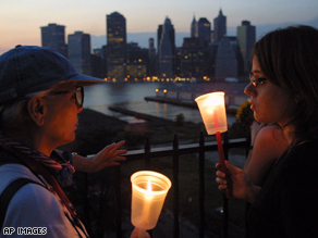 New Yorkers gather to hold a vigil to remember the victims of the 9/11 attacks.