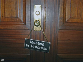 A 'Meeting In Progress' sign hangs on the door of the Senate Appropriations Committee Sunday on Capitol Hill in Washington.