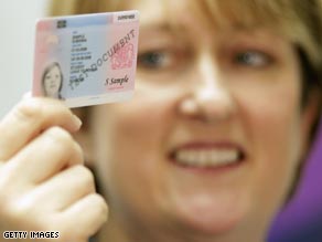 Jacqui Smith shows off the new IS card.