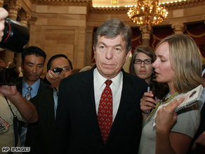 House Republican Whip Roy Blunt, (R), is pursued by reporters after the House voted down the Emergency Economic Stabilization Act of 2008.