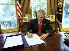 President Bush signs the Emergency Economic Stabilization Act of 2008
