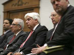 Former CEO of AIG Martin Sullivan, center, waits to testify before the House Oversight and Government Reform Committee on Tuesday. 