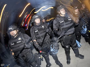 Police officers prepare for protesters during the 2008 Democratic National Convention in Denver.