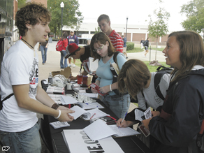 Charlie Harris, a Western Kentucky University student, talks to Courtney Yates as the One.Org bus makes a stop at Western Kentucky University as part of its cross-country trip encouraging students and others to vote.