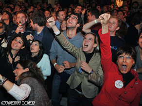 Democrat supporters celebrate in Madrid's Circulo de Bellas Artes.