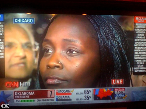 Anna Otieno watches Barack Obama's acceptance speech in Chicago's Grant Park.