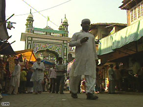 Devotees offer prayers at a Muslim neighborhood in Mumbai.