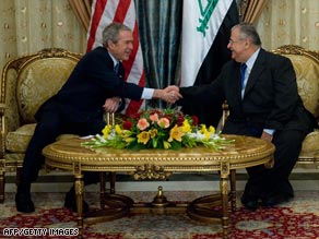 President Bush shakes hands with Iraqi President Jalal Talabani in Baghdad Sunday.