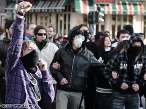 Demonstrators Monday outside Athens police headquarters.
