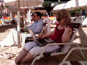 Ed Henry and producer Becky Brittain working hard on Waikiki Beach.